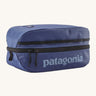 Patagonia black hole 6 litre cube bag in current blue. A 100% recycled material cube bag in dark blue with black detail. Features 1 main zip compartment with a light blue brand text on the top and a brand patch stitched on the side