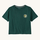 Patagonia women's unity Fitz roy responsibili tshirt available at Babipur. A green, short sleeved and boxy top with a circular brand logo printed on the chest. 
