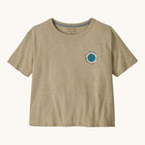Patagonia women's unity Fitz roy responsibili tshirt available at Babipur. A light brown, short sleeved and boxy top with the brand circular logo printed on the chest. 