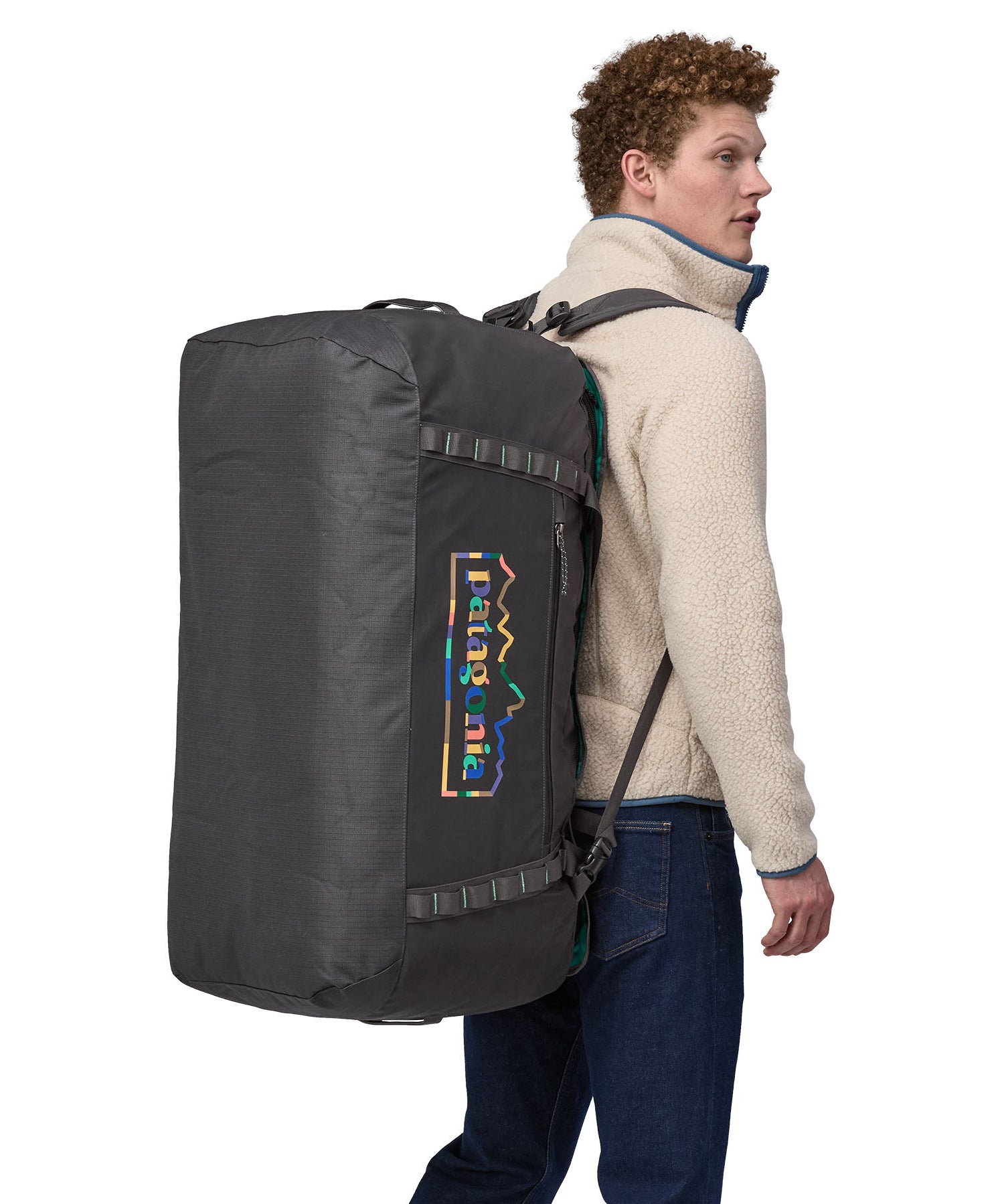 A person wearing the Patagonia Black Hole Duffel 100L Ink Black on their back