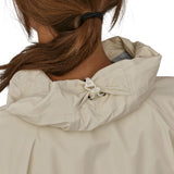 A closer look at the hood on the Patagonia Women's Torrentshell 3L Rain Jacket. The image shows a person from the back wearing the jacket, with an elasticated clip on the hood to keep the inside of the hood dry