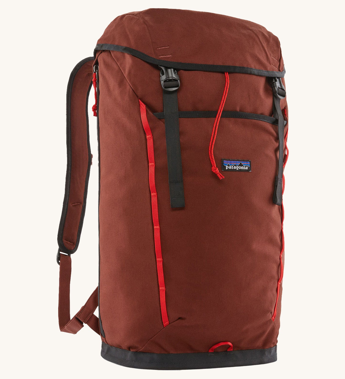Patagonia lid fieldsmith lid backpack in dried vanilla. A 100% recycled material backpack in deep red with black and red  detail. Features a lid style top cover with buckle fastenings and padded shoulder straps