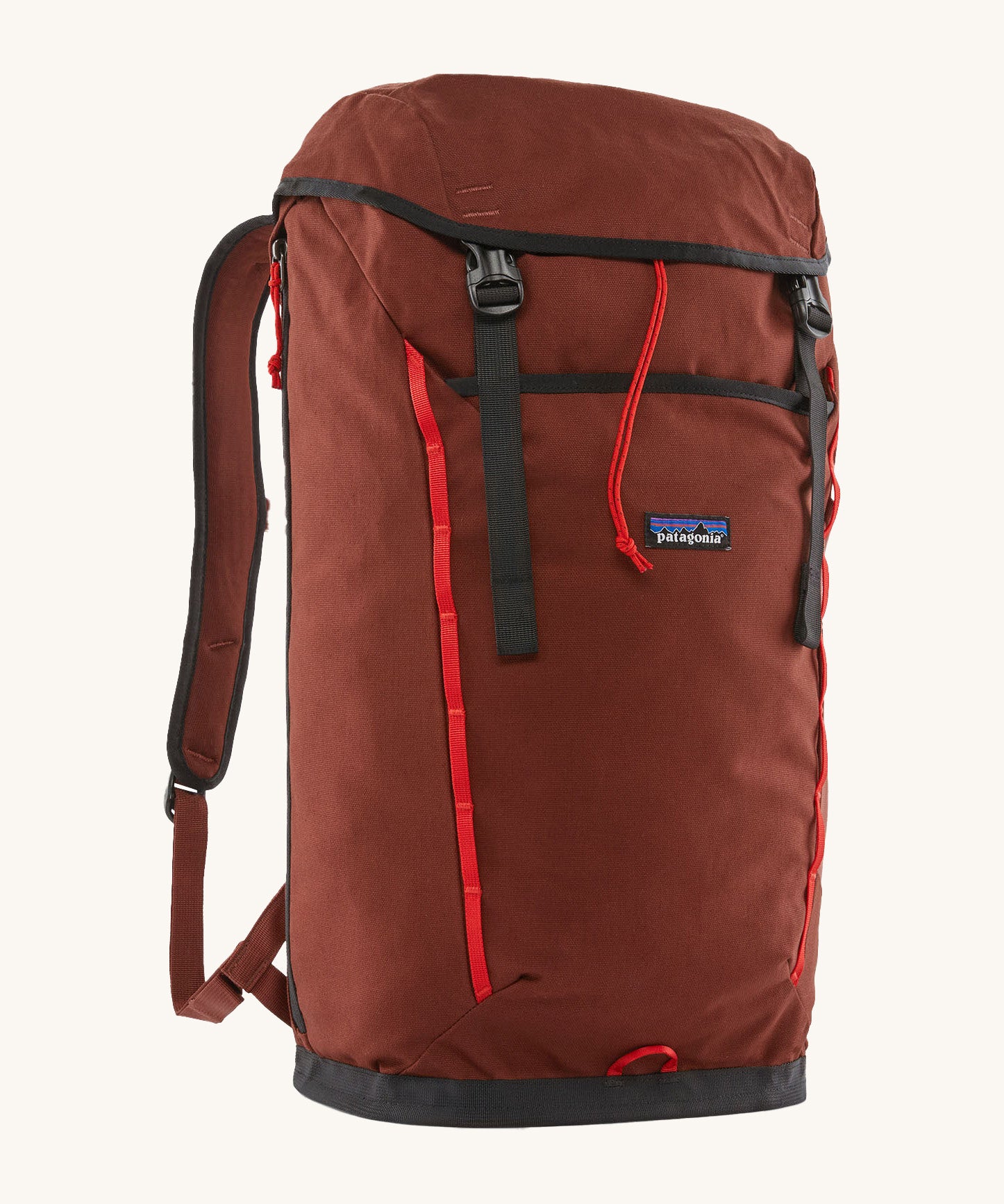 Patagonia lid fieldsmith lid backpack in dried vanilla. A 100% recycled material backpack in deep red with black and red  detail. Features a lid style top cover with buckle fastenings and padded shoulder straps