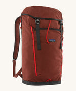 Patagonia lid fieldsmith lid backpack in dried vanilla. A 100% recycled material backpack in deep red with black and red  detail. Features a lid style top cover with buckle fastenings and padded shoulder straps