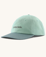 Patagonia organic cotton fitz roy icon trad cap in mint green with dark green visor brand text on the front. 