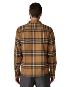 The back of the Patagonia fjord flannel shirt in catch deer brown available at Babipur worn by a man