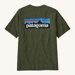 Patagonia Men's Tee - Torrey Pine Green. A dark green t-shirt made form organic cotton, with the Patagonia mountain range logo on the back