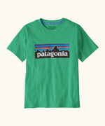 Patagonia organic cotton kids p6 logo short sleeve t-shirt in green with large brand patch on upper body
