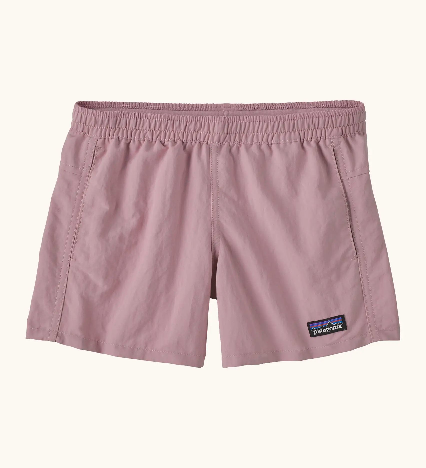 Patagonia kid's unlined quick drying baggies shorts in pale purple with elasticated small black logo label on the front. 