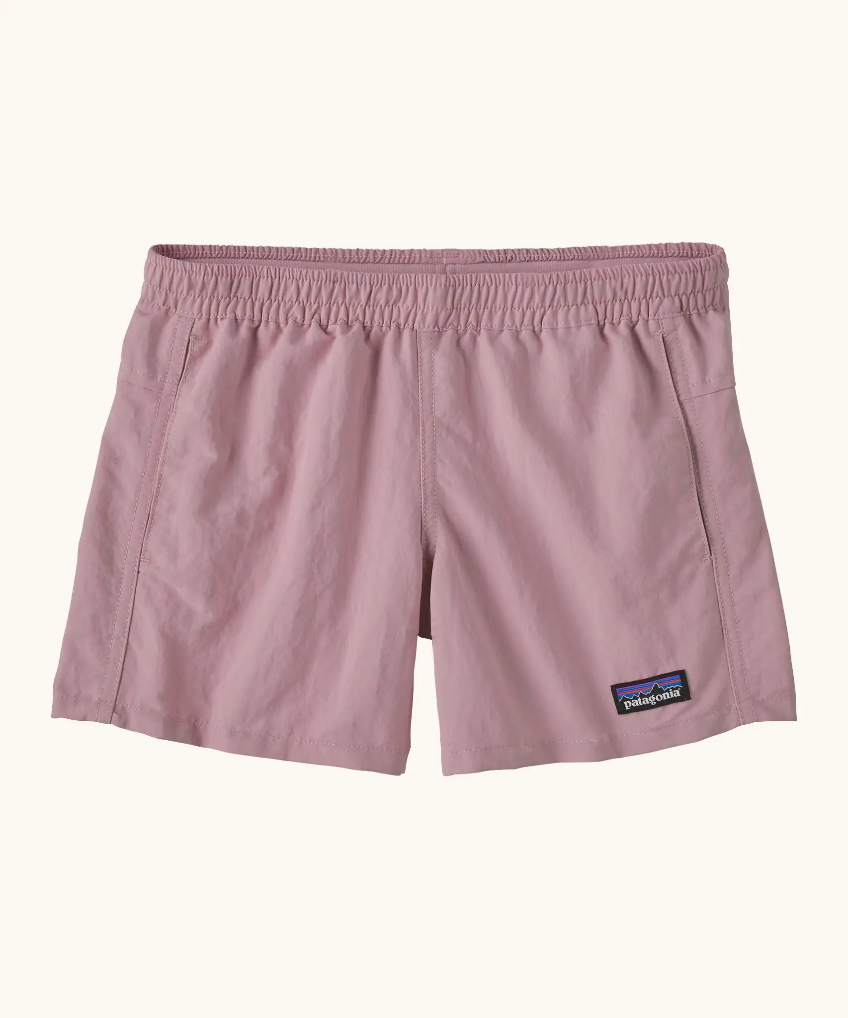 Patagonia kid's unlined quick drying baggies shorts in pale purple with elasticated small black logo label on the front. 