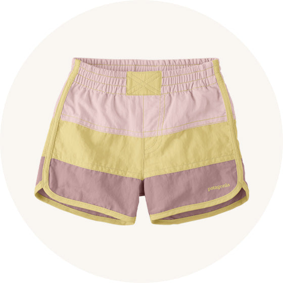 Patagonia Baby swim Boardshorts in pink yellow and mauve colourblock with elasticated waistband to represent Patagonia kids bottoms and shorts at Babipur.