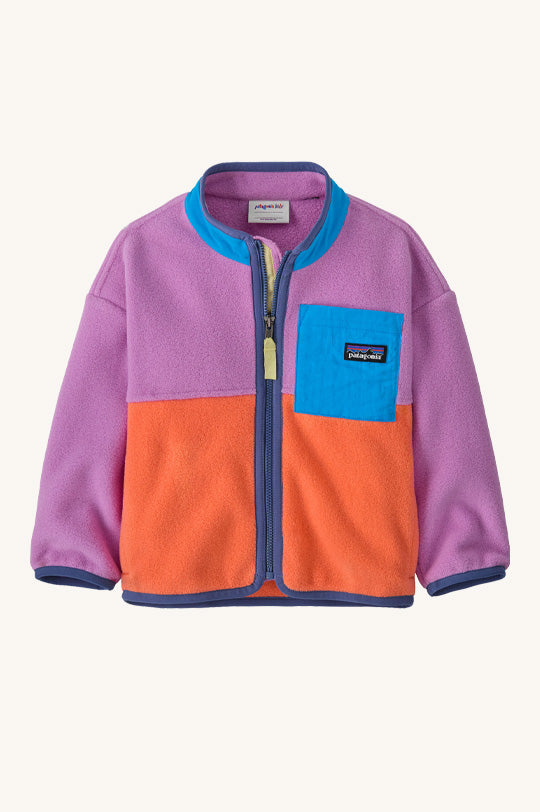 Patagonia Little Kids Synchilla® Fleece in Brisk Purple with a blue collar and square breast pocket with an orange bottom half and purple piping and zip to represent kids Patagonia clothing for sale at Babipur.