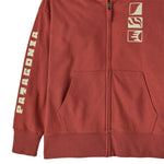 A close up of the Patagonia kids full zip hoody sweatshirt in mother ray/potters red available at Babipur showing the pocket and cream graphic detail.