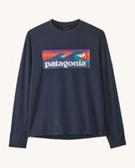 Patagonia kids long sleeve capilene boardshort tshirt in navy with brand patch on upper body and thumb holes