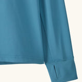 Close up of Patagonia kids long sleeve capilene tshirt in bright blue showing thumb hole on sleeve