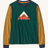 Patagonia kids long sleeve graphic top in driftways/cascade green available at Babipur.. A 100% regenerative cotton top with long sleeves in green and dark yellow with navy trim. Features a mountain logo design on the front.