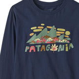 A close up of the front of the Patagonia kids long sleeve graphic top in fitz roy foliage/navy available at Babipur.. A 100% regenerative cotton top with long sleeves in navy. Features a funky mountain branding design on the front.