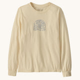 Patagonia kids long sleeve graphic top in skisel/undyed natural available at Babipur.. A 100% regenerative cotton top with long sleeves in cream. Features a funky snowflake branding design on the front.