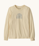 Patagonia kids long sleeve graphic top in skisel/undyed natural available at Babipur.. A 100% regenerative cotton top with long sleeves in cream. Features a funky snowflake branding design on the front.
