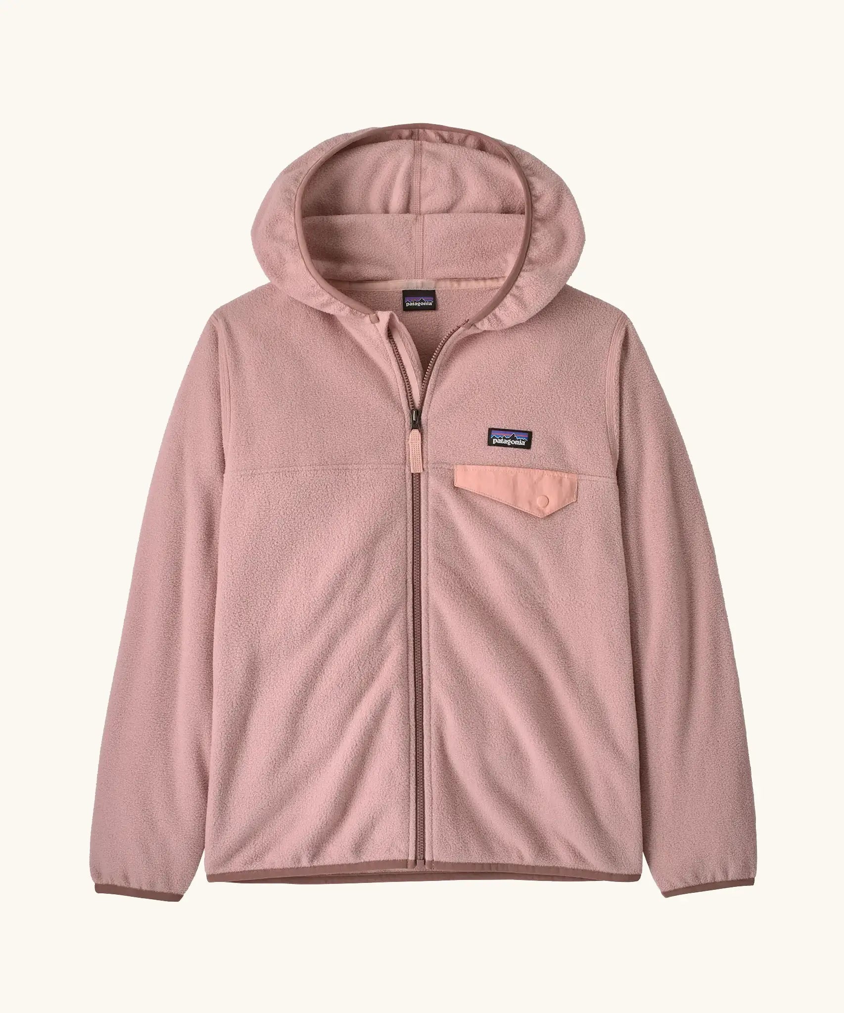 Patagonia Kids' Micro D Snap-T Hooded Fleece Jacket in Fuzzy Mauve. Pastel pink body with soft brown binding and a pink chest pocket.
