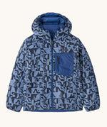 Patagonia Kids Reversible Down Hoody in mother tree sunken blue. A long sleeve jacket with retro blue shapes. Features a full length zip and blue chest pocket. 