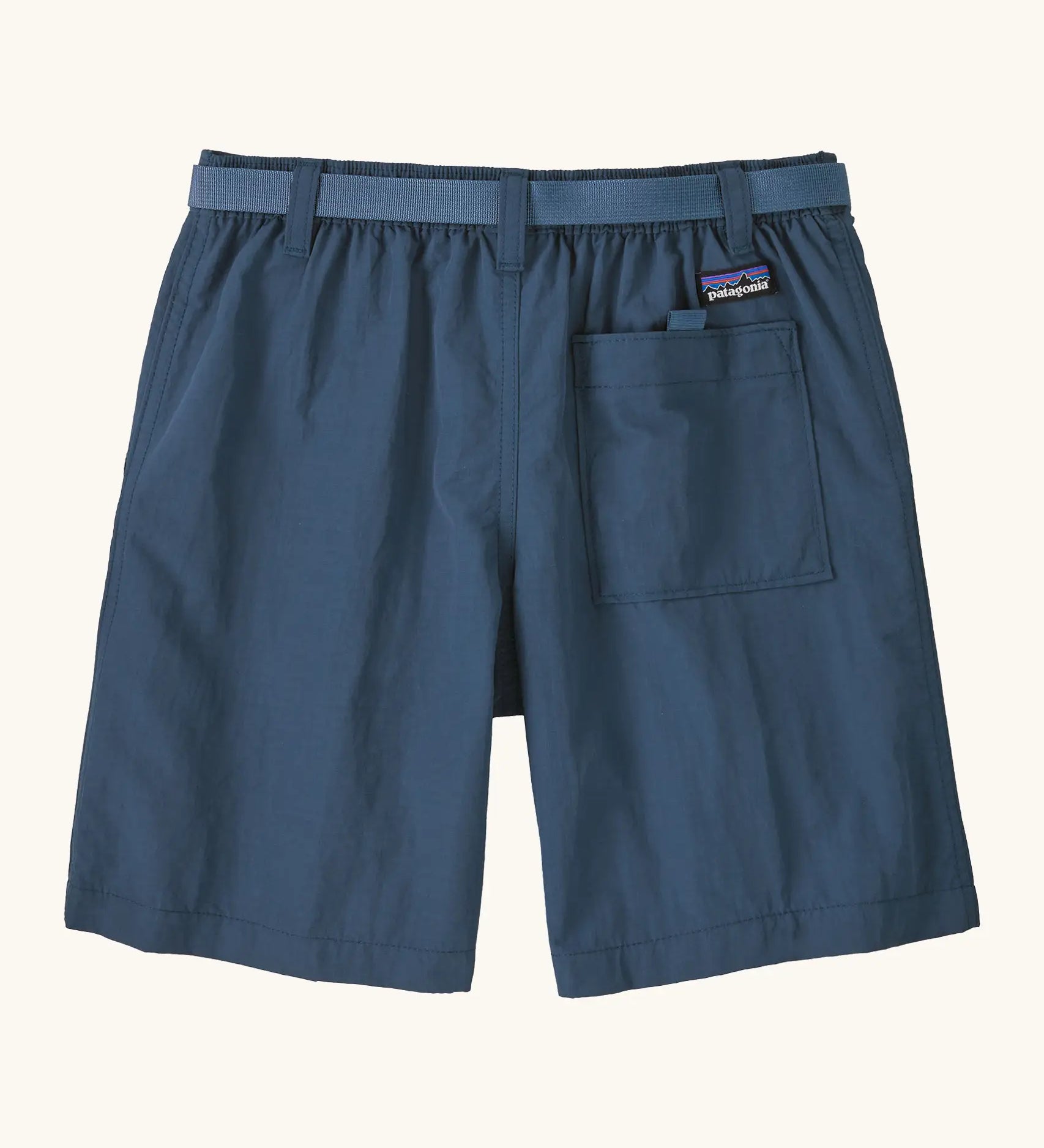 Patagonia kid's outdoor everyday 6 inch shorts in dark blue showing a back pocket with velcro tab