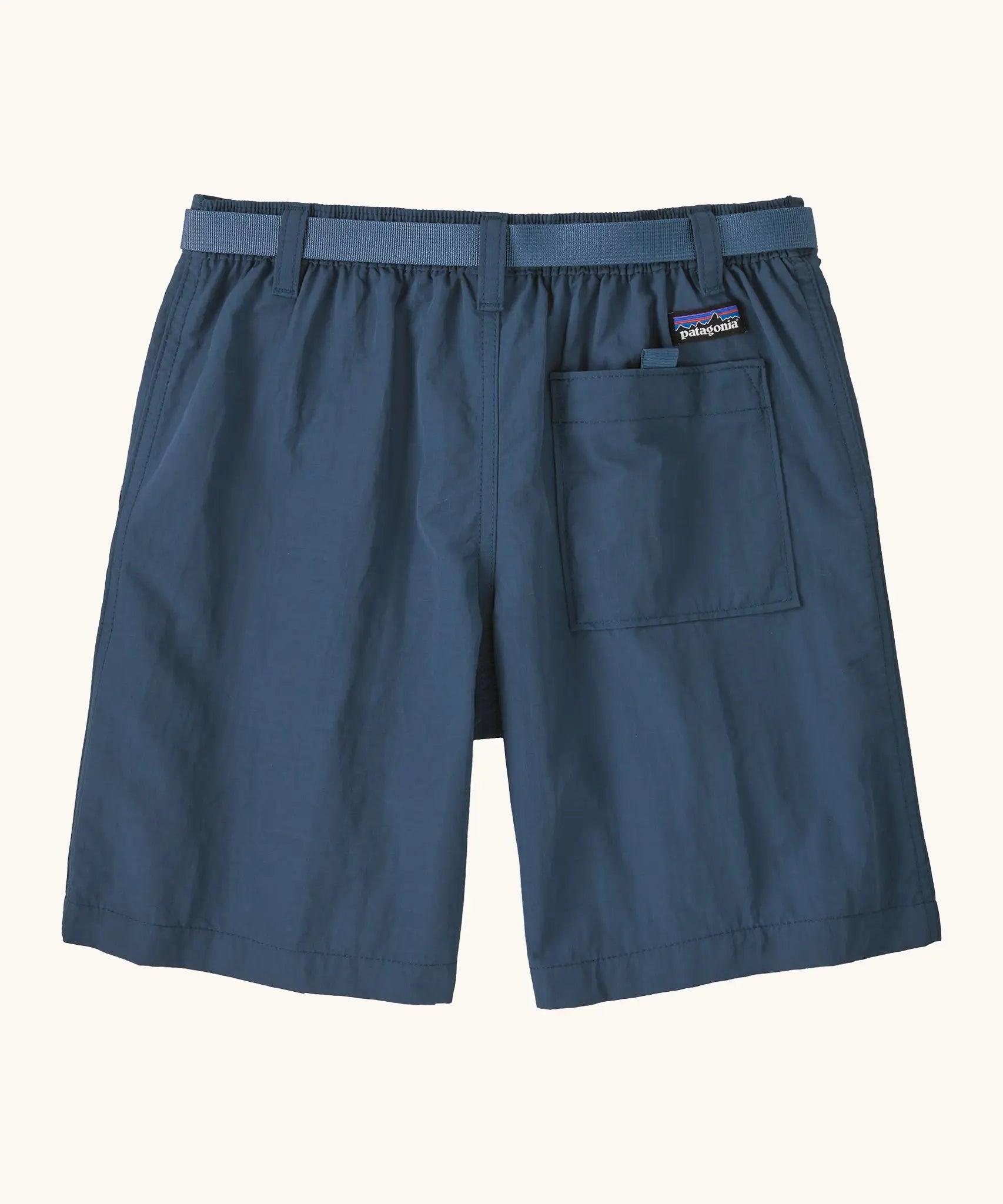 Patagonia kid's outdoor everyday 6 inch shorts in dark blue showing a back pocket with velcro tab