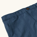 Close up of the elasticated waistband on the Patagonia kid's outdoor everyday 6 inch shorts in dark blue 