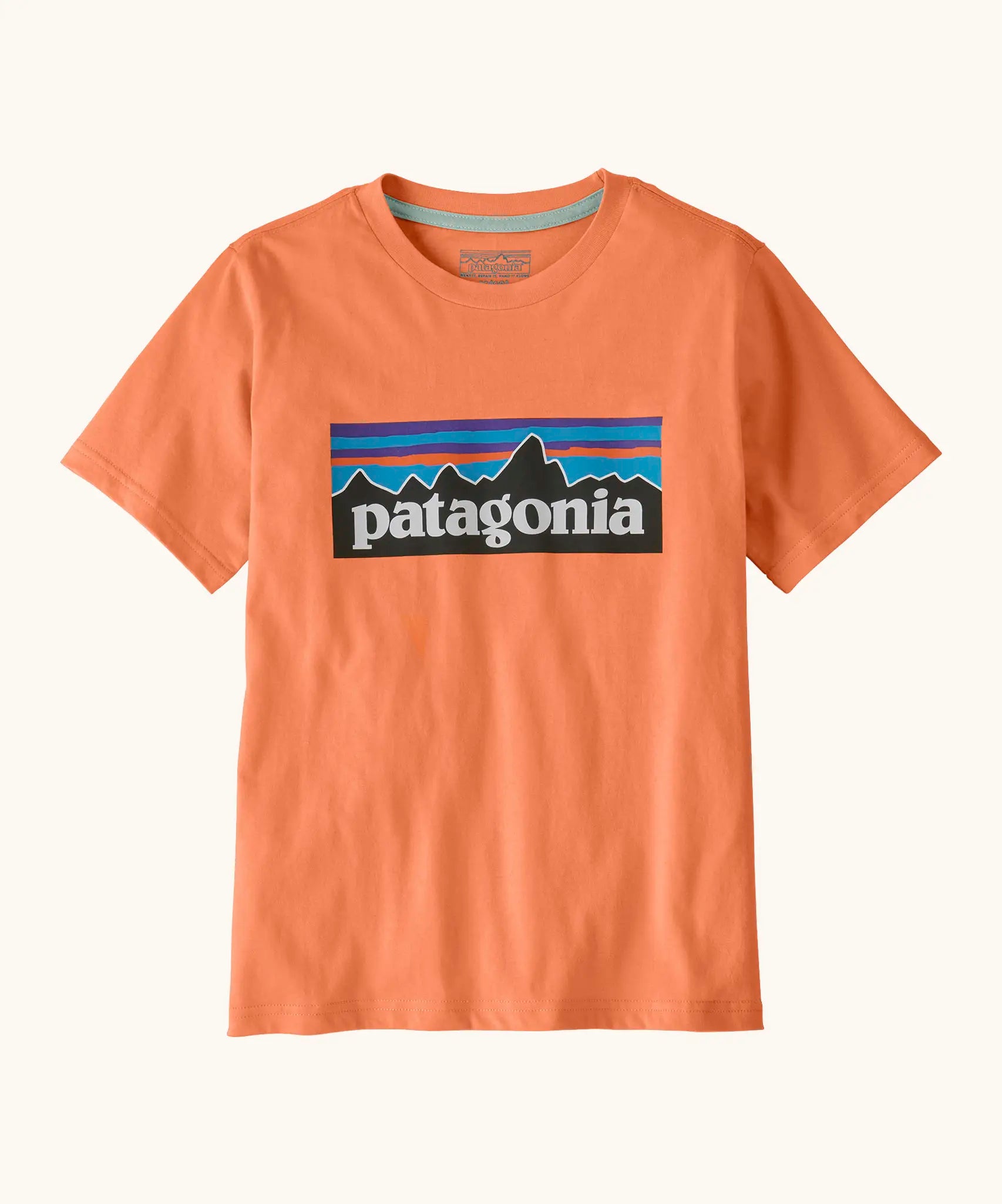Patagonia organic cotton kids p6 logo short sleeve t-shirt in orange with large brand patch on upper body