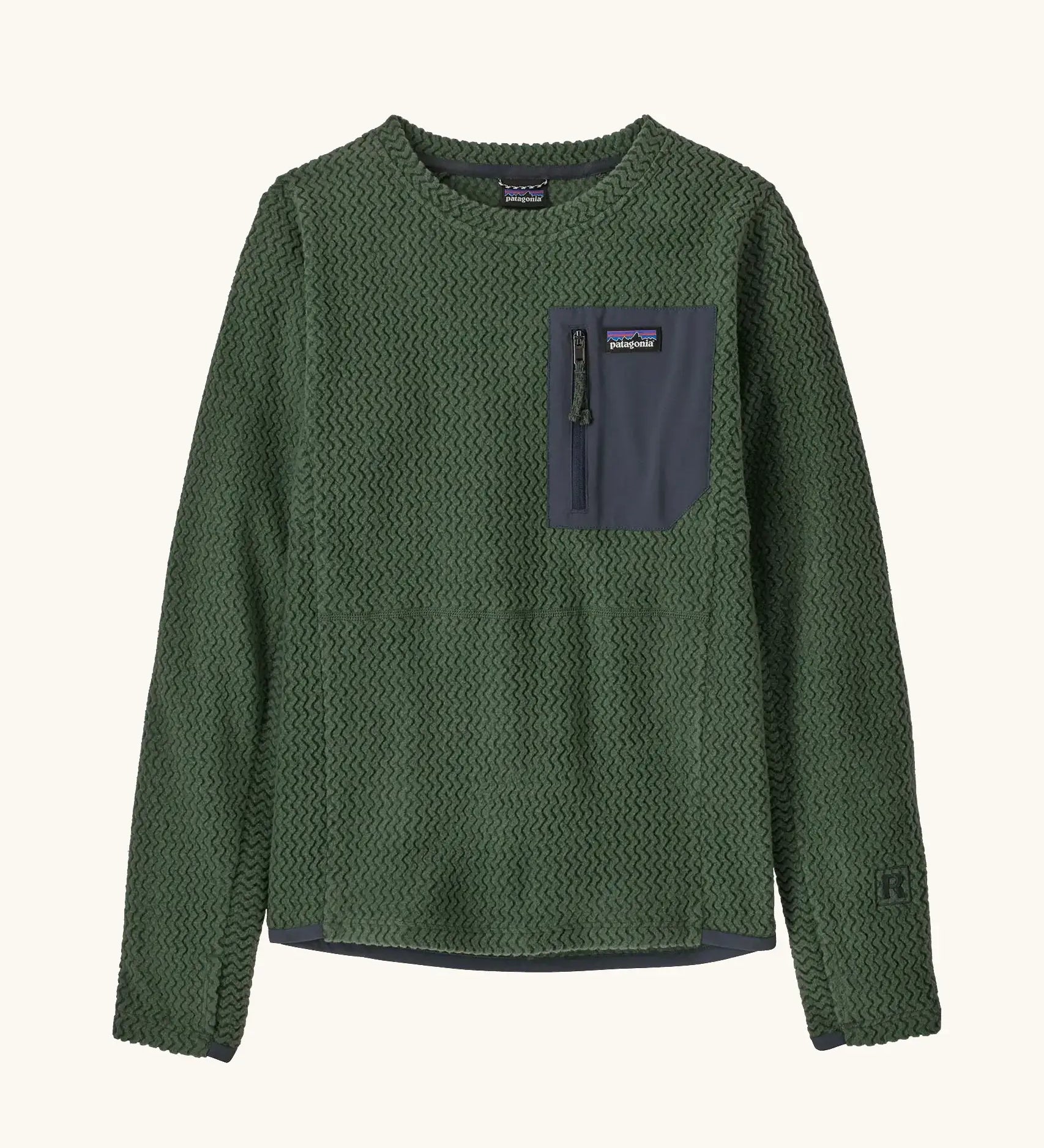 Patagonia kids R1 Air Crew in Canopy green. Forest green ribbed body with dark grey binding and square chest zip pocket, and thumb holes.