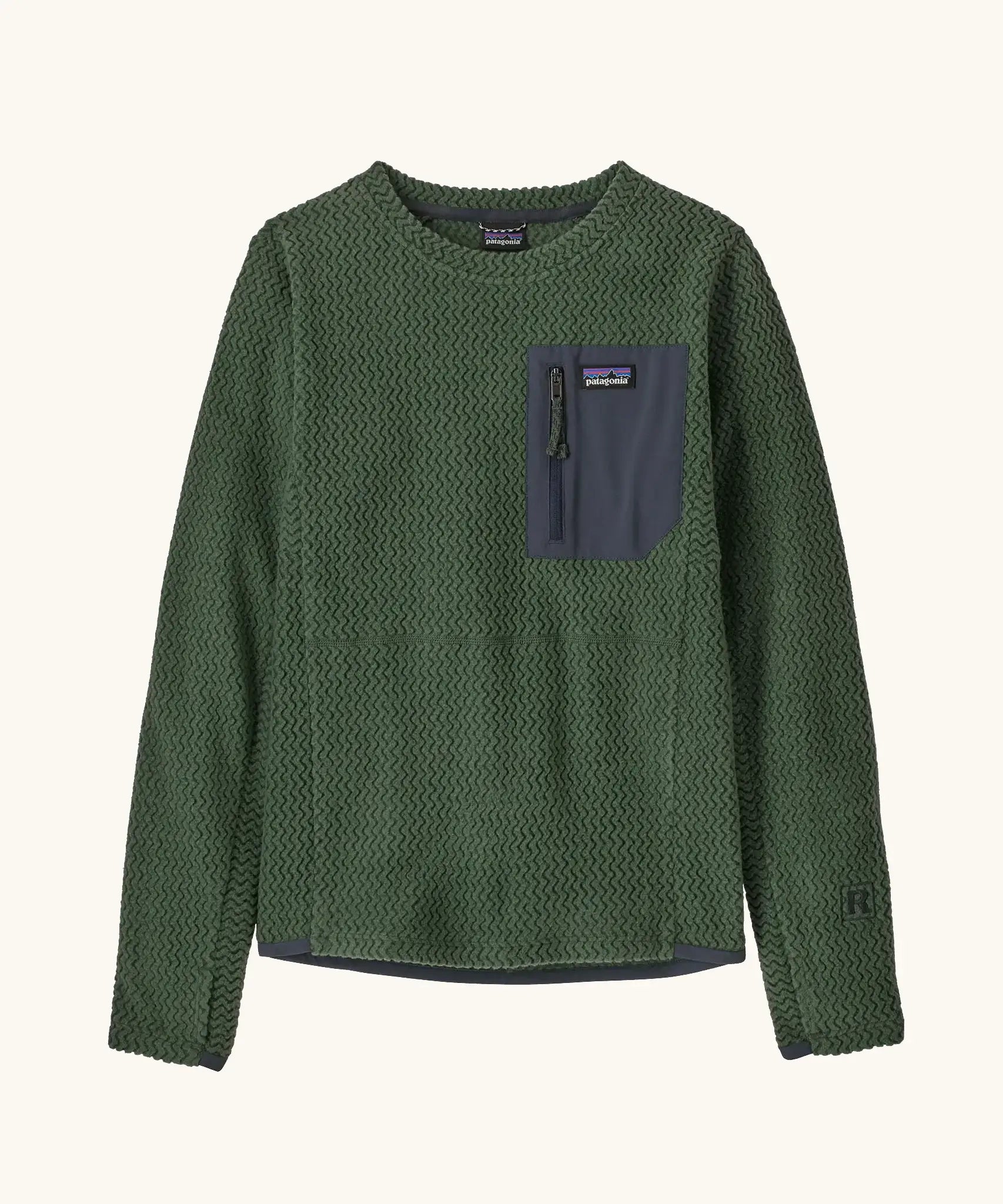 Patagonia kids R1 Air Crew in Canopy green. Forest green ribbed body with dark grey binding and square chest zip pocket, and thumb holes.