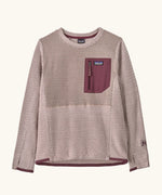 Patagonia Kids R1 Air Crew in pink frost. Pale pink ribbed body with contrasting maroon binding and square chest zip pocket, and thumb holes.