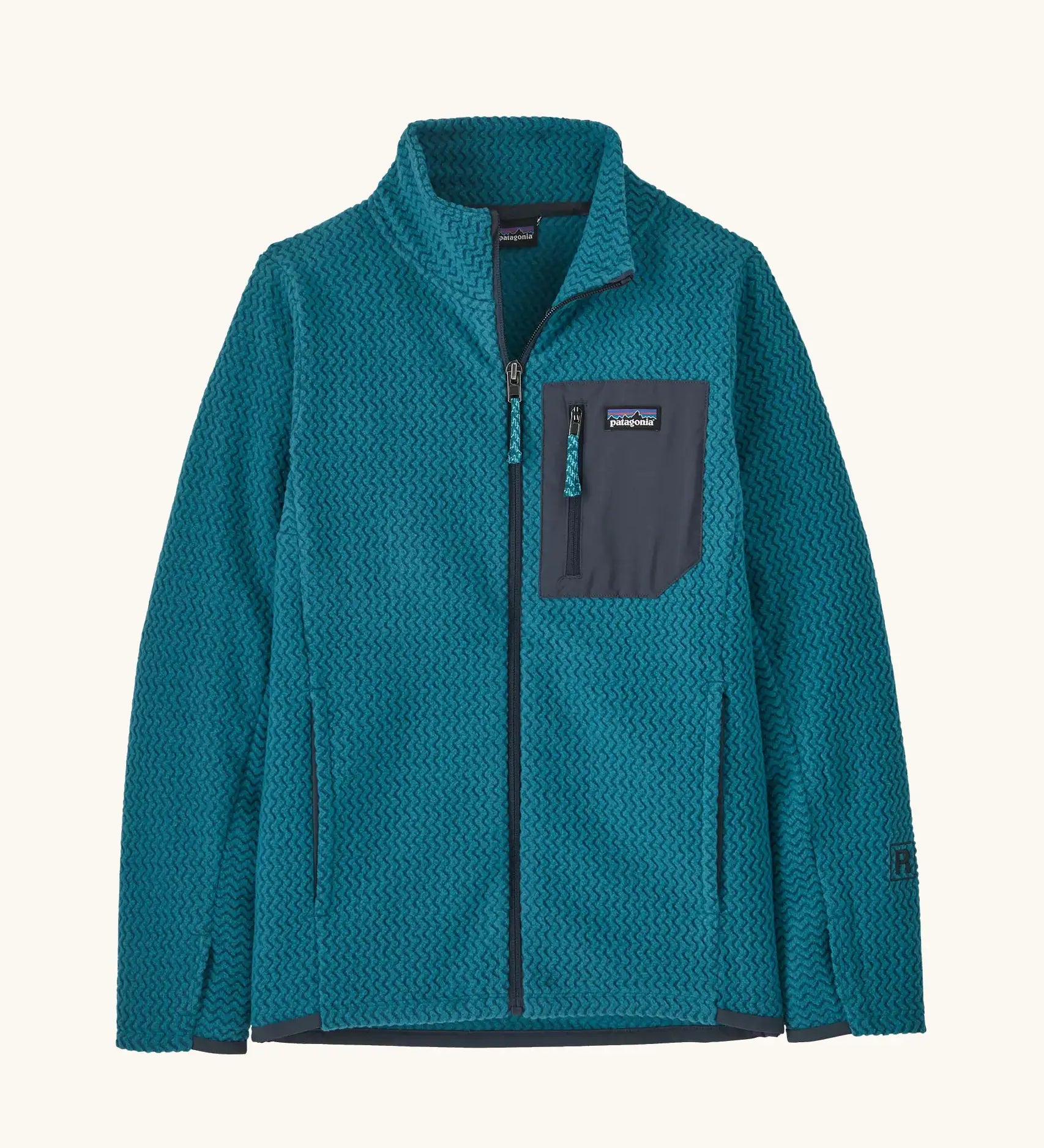 Patagonia Kids R1 Air Full-Zip Fleece Jacket in Glacial Blue. Deep blue ribbed body with dark grey binding, square chest pocket and full front zip. With thumb holes.