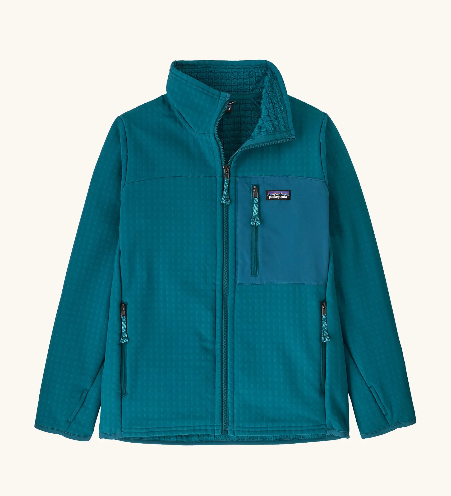 Patagonia Kids R2 Techface Jacket in Glacial Blue. Deep turquoise Jacket with full length front zip, fleece interior, side and chest pockets and thumb holes.