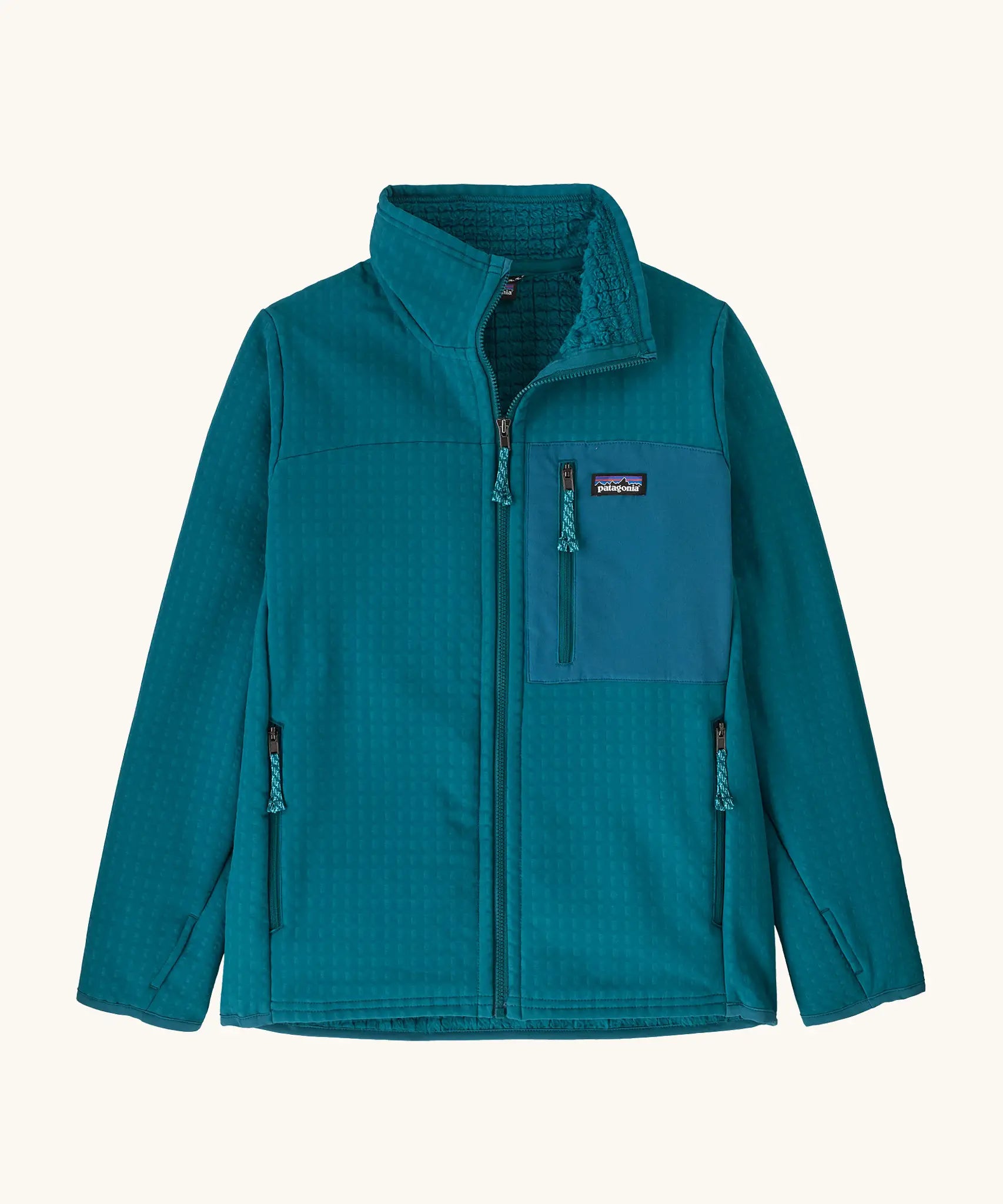 Patagonia Kids R2 Techface Jacket in Glacial Blue. Deep turquoise Jacket with full length front zip, fleece interior, side and chest pockets and thumb holes.