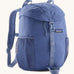 Patagonia kids refugio 12 litres backpack in dark and light blue available at Babipur.. Features padded shoulders, 2 side pockets and a flip lid with a buckle fastener. 