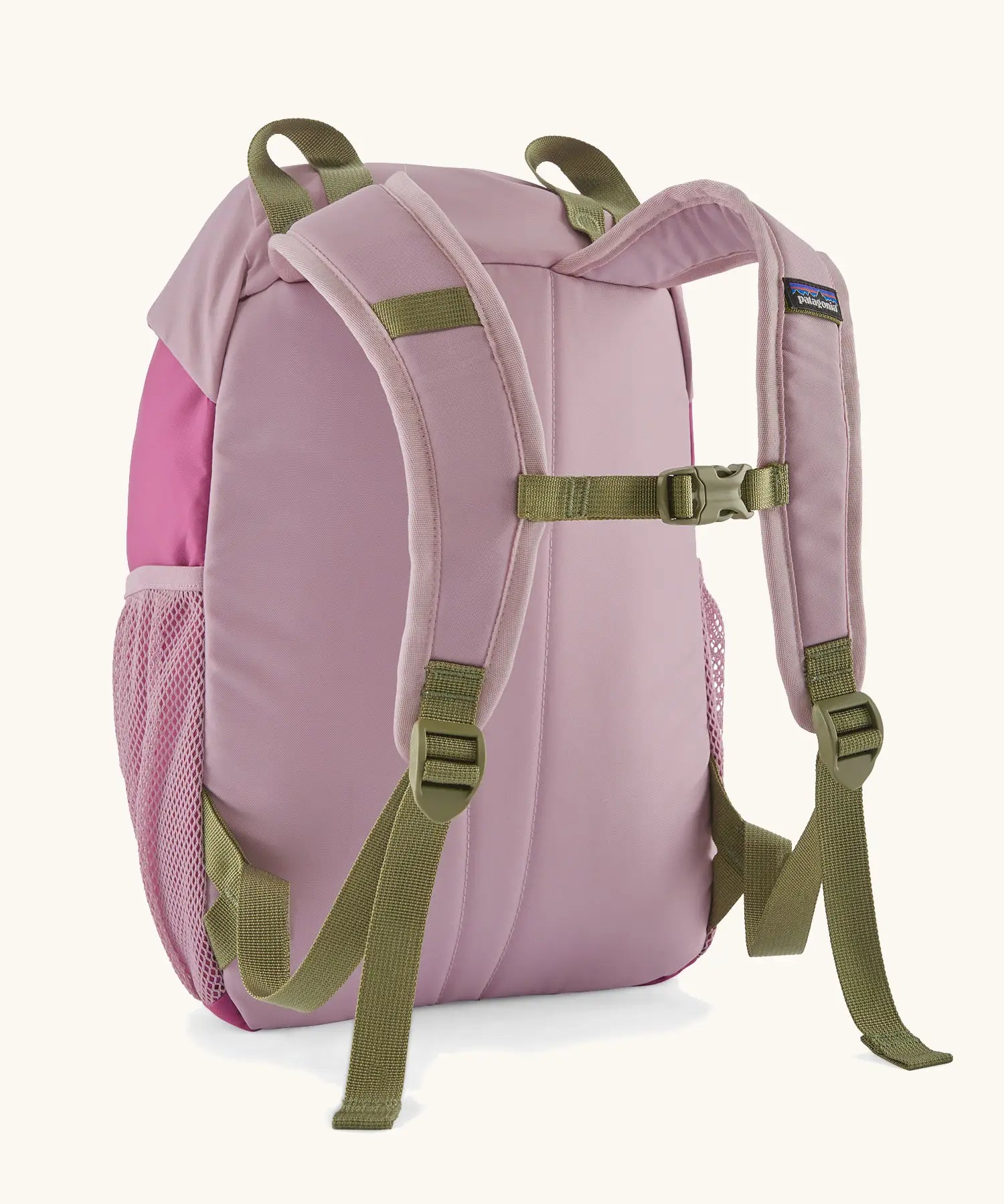 Back of Patagonia kids refugito 12L day pack in pale purple showing green quick release buckle strap between shoulder straps