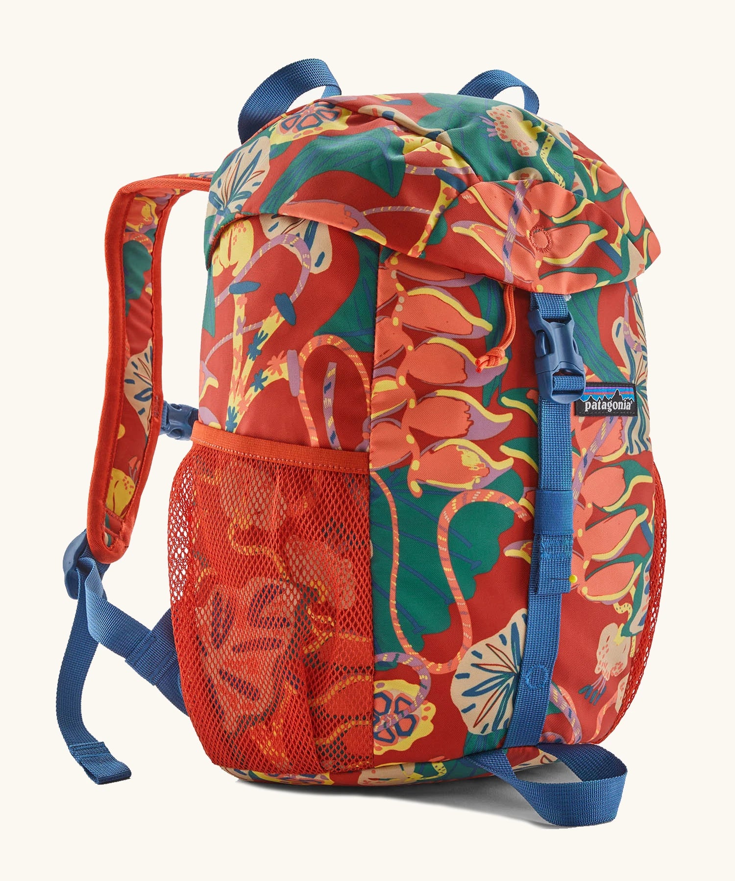 Patagonia kids refugito 12L day pack in red with a repeating tropical flower design. Shows front buckle lid fastener and mesh pockets