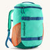 Patagonia kids refugito 18L day pack in bright teal with orange mesh side pockets and 2 blue front buckles on the front 