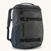 Patagonia refugito 18 litres daypack in sunken blue. A black backpack made from 100% recycled materials and features 2 side mesh pockets, buckle fasteners on the front to keep it secure and a zip on the top for easy access.