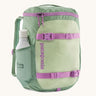 Patagonia refugito 18 litres daypack in ellwood green. A pastel green backpack with 2 side mesh pockets, pink buckle, fasteners on the front to keep it secure and a zip on the top for easy access with padded shoulder straps.