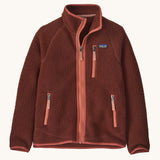 Patagonia kids retro pile fleece jacket in dried vanilla available at Babipur. A 100% recycled polyester thick fleece in dark red with pale red trim. Features a turn up collar, full length zip, 2 side zip pockets and chest pocket.