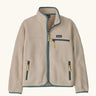 Patagonia Kids Retro Pile Jacket in Dark Natural. Cream fleece body with light sage green binding and zip pockets with pale yellow details.