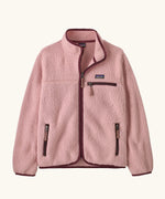 Patagonia Kids retro pile jacket in Fuzzy Mauve. Light pink fleece with maroon binding and contrasting zip pockets.