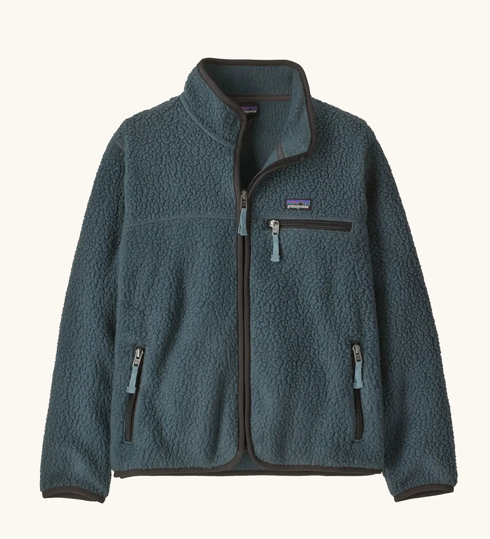 Patagonia Kids Retro Pile Jacket in Summit Blue. Slate fleece body with three zip pockets and darker binding.