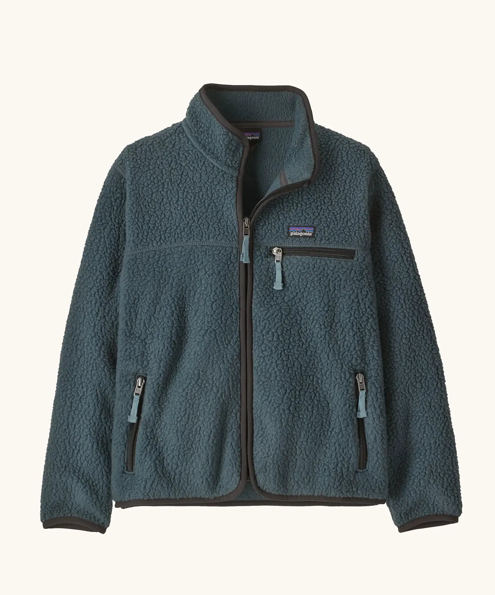 Patagonia Kids Retro Pile Jacket in Summit Blue. Slate fleece body with three zip pockets and darker binding.