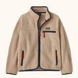 Patagonia Kids Retro Pile Jacket in Valley Khaki. Cream fleece body with Navy blue binding and zip pockets with red details.