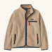 Patagonia Kids Retro Pile Jacket in Valley Khaki. Cream fleece body with Navy blue binding and zip pockets with red details.