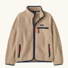 Patagonia Kids Retro Pile Jacket in Valley Khaki. Cream fleece body with Navy blue binding and zip pockets with red details.