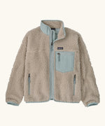 Patagonia Kids Retro X Fleece Jacket in Natural with Virtually blue. Cream fleece with contrasting pale blue binding, collar and square chest pocket.